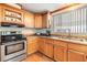 Stainless steel appliances and light wood cabinets at 37538 New Horizons Blvd, Zephyrhills, FL 33541