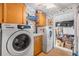 Laundry room with Samsung washer and dryer, and storage at 37538 New Horizons Blvd, Zephyrhills, FL 33541
