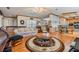 Spacious living room with hardwood floors, floral couch and a coffee table at 37538 New Horizons Blvd, Zephyrhills, FL 33541