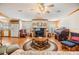 Spacious living room featuring a fireplace and ample seating at 37538 New Horizons Blvd, Zephyrhills, FL 33541