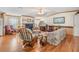 Living room with hardwood floors, fireplace, and comfortable seating at 37538 New Horizons Blvd, Zephyrhills, FL 33541