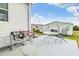 Concrete patio with metal table and chairs, ideal for outdoor dining at 37538 New Horizons Blvd, Zephyrhills, FL 33541