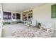 Covered porch with seating area, perfect for relaxing outdoors at 37538 New Horizons Blvd, Zephyrhills, FL 33541