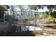 Enclosed backyard with a chain link fence and a small concrete slab at 3915 W Paxton Ave, Tampa, FL 33611