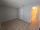 Simple bedroom with tile floors and an adjacent bathroom at 4031 Tumble Wood Trl # 203, Tampa, FL 33613