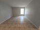 Spacious bedroom with tile flooring and large window at 4031 Tumble Wood Trl # 203, Tampa, FL 33613