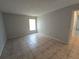 Bedroom with tile floors and window at 4031 Tumble Wood Trl # 203, Tampa, FL 33613