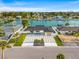 Attractive waterfront home with sleek driveway, complemented by lush landscaping and a charming neighborhood setting at 407 41St Ave, St Pete Beach, FL 33706