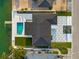 Stunning aerial view of the luxurious home, featuring a pristine pool, modern patio, and beautifully landscaped yard at 407 41St Ave, St Pete Beach, FL 33706