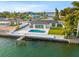 Aerial view of waterfront home featuring a pool and private dock at 407 41St Ave, St Pete Beach, FL 33706