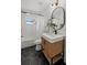 Bathroom with black hexagon tile, modern vanity and black hardware at 407 41St Ave, St Pete Beach, FL 33706