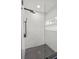Shower boasts black hardware, glass wall, and modern tile design at 407 41St Ave, St Pete Beach, FL 33706