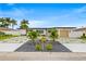 Beautiful modern home with a unique driveway design, lush landscaping and updated exterior at 407 41St Ave, St Pete Beach, FL 33706