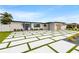 Home featuring a striking entrance with modern design elements and a unique driveway at 407 41St Ave, St Pete Beach, FL 33706