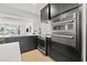 Gourmet kitchen featuring modern appliances and range, built in oven, and light hardwood flooring at 407 41St Ave, St Pete Beach, FL 33706