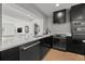 A sleek kitchen with stainless steel appliances and white countertops overlooking the living room and scenic waterfront views at 407 41St Ave, St Pete Beach, FL 33706