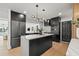 Modern kitchen with stainless steel appliances and an island with a white countertop at 407 41St Ave, St Pete Beach, FL 33706