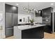 Contemporary kitchen with stainless steel appliances, center island and plenty of cabinet space at 407 41St Ave, St Pete Beach, FL 33706