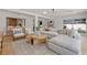 Living room featuring stylish seating and large windows with views into the kitchen at 407 41St Ave, St Pete Beach, FL 33706