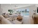 Beautiful living room with waterfront views, spacious seating, and stylish decor at 407 41St Ave, St Pete Beach, FL 33706