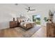 Serene main bedroom with modern furnishings, hard wood floors, and access to outdoor views at 407 41St Ave, St Pete Beach, FL 33706