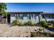 Home features a patio and partial view of backyard at 4573 Deltona Blvd, Spring Hill, FL 34606