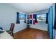 Bright bedroom with large windows and a workspace at 4573 Deltona Blvd, Spring Hill, FL 34606