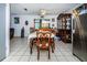 Bright dining room featuring a wooden table and chairs, and a hutch at 4573 Deltona Blvd, Spring Hill, FL 34606