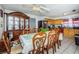 Bright dining room with wood table and chairs, and built-in hutch at 4573 Deltona Blvd, Spring Hill, FL 34606