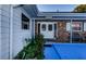 Front entrance with double doors and brick facade at 4573 Deltona Blvd, Spring Hill, FL 34606