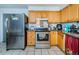Kitchen features light wood cabinets and stainless steel appliances at 4573 Deltona Blvd, Spring Hill, FL 34606