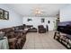 Living room with sectional sofa and ceiling fan at 4573 Deltona Blvd, Spring Hill, FL 34606