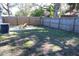 Simple backyard with a wooden fence and grassy area at 4684 25Th S Ave, St Petersburg, FL 33711