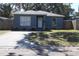 Cute bungalow with gray exterior, stone accents, and a driveway at 4684 25Th S Ave, St Petersburg, FL 33711