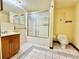 Clean bathroom with shower/tub combo and wood vanity at 4825 Sierra Madre Dr, Tampa, FL 33634
