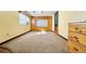 Cozy carpeted bedroom with built-in wood cabinets and window seat at 4825 Sierra Madre Dr, Tampa, FL 33634