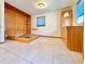 Bedroom with wood-paneled walls and built-in storage at 4825 Sierra Madre Dr, Tampa, FL 33634