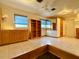 Bedroom with wood-paneled walls and built-in storage at 4825 Sierra Madre Dr, Tampa, FL 33634