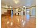 Bright living room featuring hardwood floors and kitchen access at 4825 Sierra Madre Dr, Tampa, FL 33634