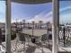 Balcony with water views and wrought iron railings at 507 Tamiami N Trl # 201, Venice, FL 34285