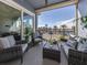 Relaxing balcony with water views and wicker furniture at 507 Tamiami N Trl # 201, Venice, FL 34285