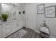 Spa-like bathroom with a large mirror and walk-in shower at 507 Tamiami N Trl # 201, Venice, FL 34285