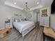Bright bedroom featuring a king-size bed and neutral decor at 507 Tamiami N Trl # 201, Venice, FL 34285