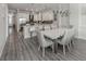 Modern dining room with white table and gray chairs at 507 Tamiami N Trl # 201, Venice, FL 34285