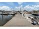 Concrete dock with various boats at 507 Tamiami N Trl # 201, Venice, FL 34285