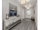 Spacious entryway with a stylish console table and light flooring at 507 Tamiami N Trl # 201, Venice, FL 34285