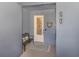 Inviting condo entry with a bench and decorative heart at 507 Tamiami N Trl # 201, Venice, FL 34285