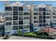 Condo building showcasing multiple balconies and water access at 507 Tamiami N Trl # 201, Venice, FL 34285