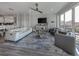 Open concept living area with white couch and kitchen view at 507 Tamiami N Trl # 201, Venice, FL 34285