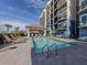 Resort-style pool with lounge chairs and a shaded area at 507 Tamiami N Trl # 201, Venice, FL 34285